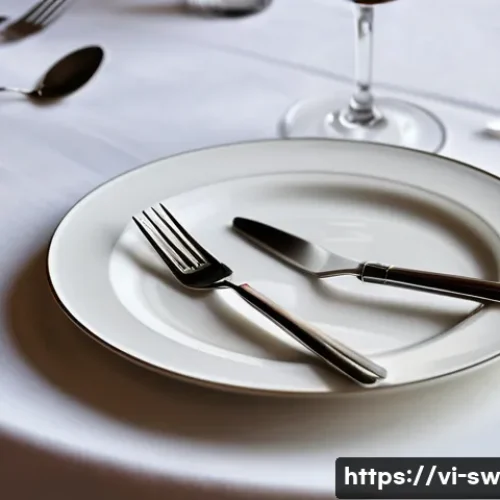스위스에서 팁 문화와 식사 매너 - A refined Swiss dining table scene showing a neatly set plate with a fork and knife positioned paral...